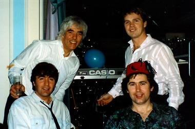 Original line-up - circa 1990; Standing: Graham le Poidevin, Darius Rowland; Sitting: Tim Millard, Lloyd Munro Original line-up - circa 1990; Standing: Graham le Poidevin, Darius Rowland; Sitting: Tim Millard, Lloyd Munro